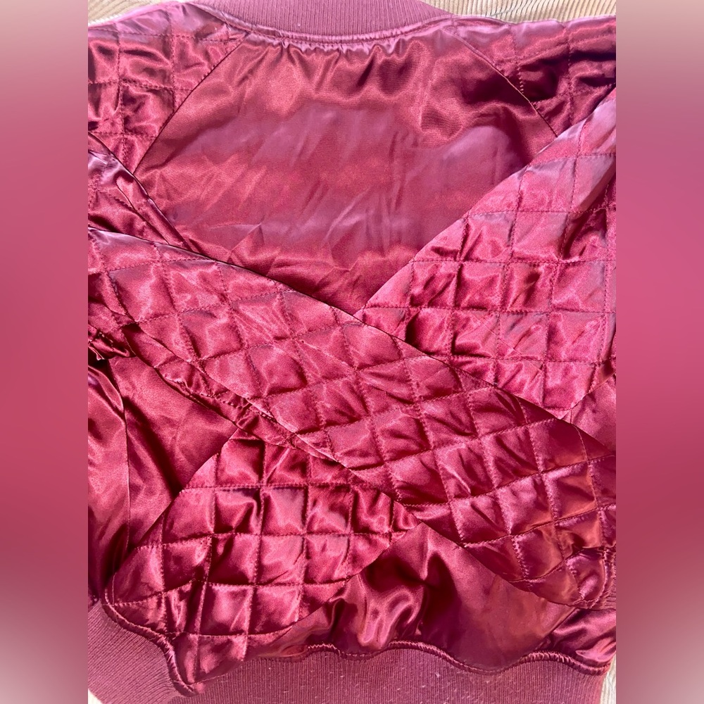 Women’s maroon bomber jacket